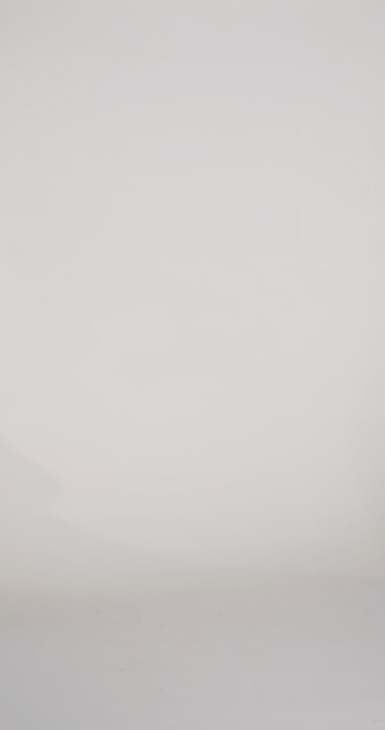 Woman models a blue strapless slim dress with a slit, exposed corset boning, a pleated band over the bust, and a sweep train, turning to show the lace-up back before walking off screen.