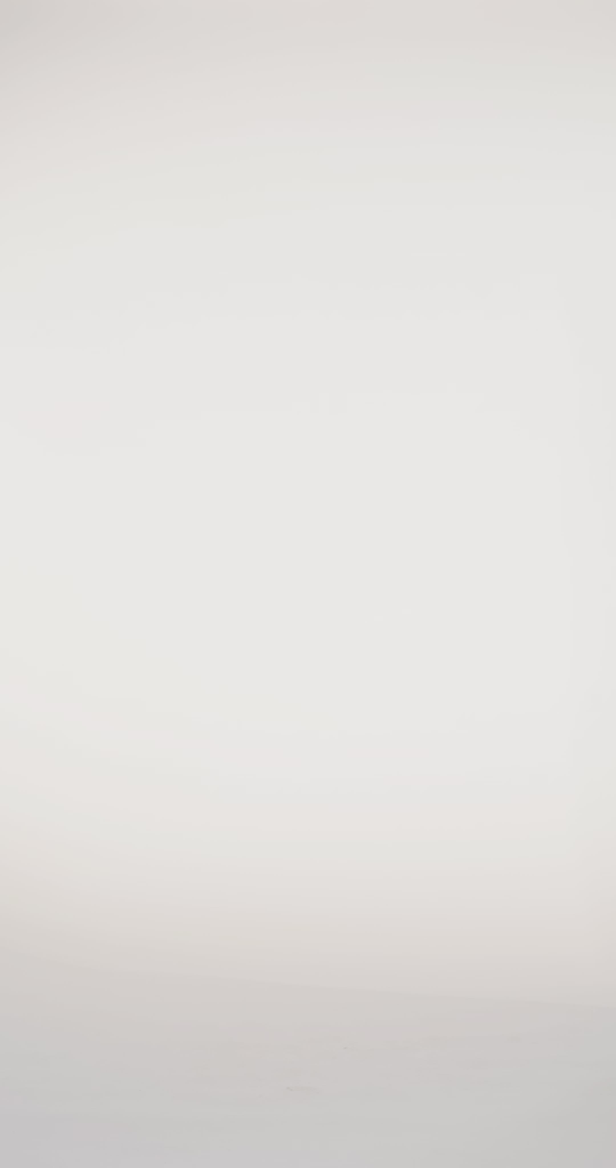 Woman models a blue off-the-shoulder slim dress with a high slit, draped panel, and lace and sparkle detailing on the bodice, waving the drape panel and turning to show the lace-up back before walking off screen.