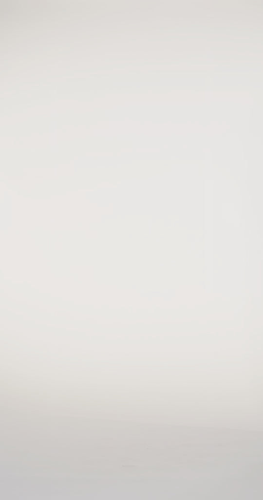 Woman models a blue off-the-shoulder slim dress with a high slit, draped panel, and lace and sparkle detailing on the bodice, waving the drape panel and turning to show the lace-up back before walking off screen.