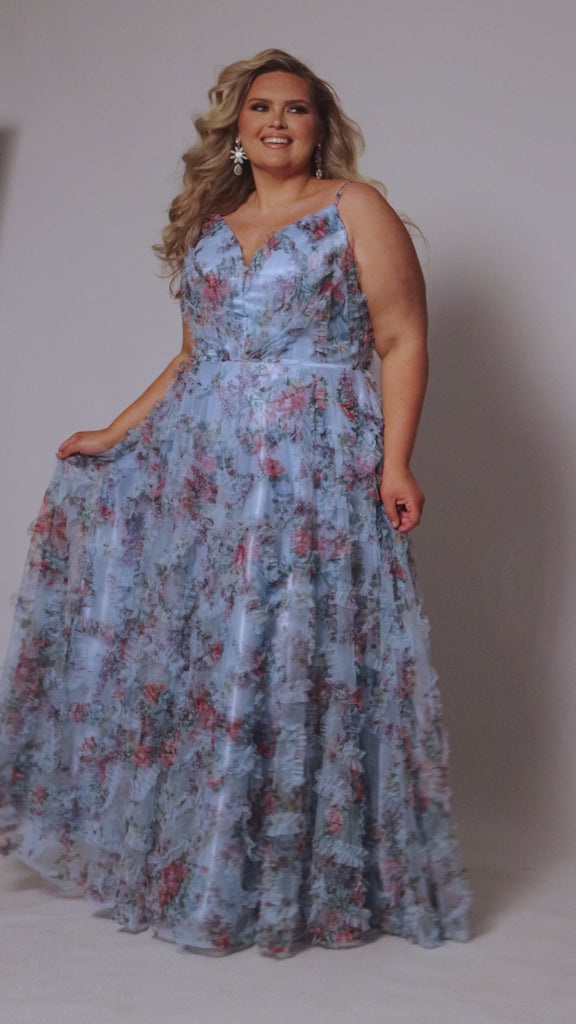 Plus size 3D floral print A-line prom dress.  V-neckline with spaghetti straps, mesh insert and pleated bodice. A-line skirt with pockets. Availablit in light blue, hot pink, royal blue and lilac in sizes 14-32. Style TE2508 from Tease Prom.