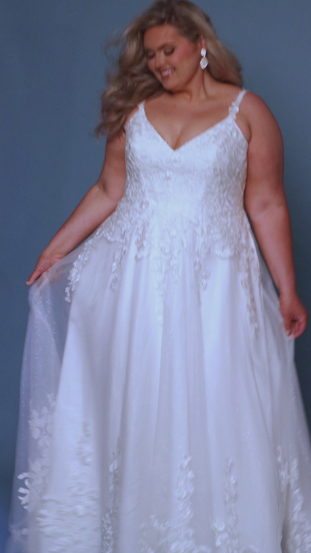 Sydney's Closet SC5322 Ivory. A-line silhouette, Rose and floral appliques, Sparkle tulle and soft bridal tulle, V-neckline, Bustier bodice with exposed boning, Spaghetti straps covered in lace, V-back, Long invisible center back zipper, Unlined back bodice, Optional back bodice lining included, A-line skirt, Pockets.