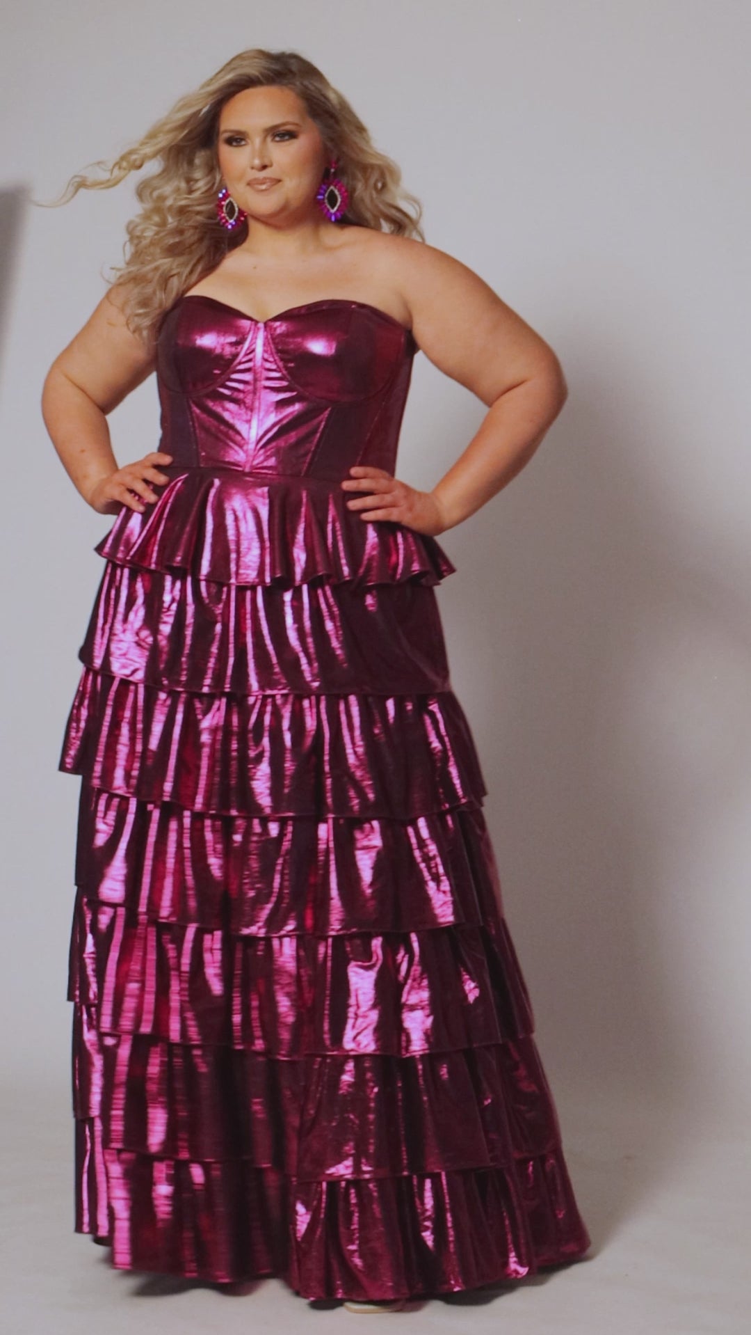 SC7405 by Sydney's Closet. Plus size strapless sweetheart metallic knit gown with exposed boning on bodice.  Tiered A-line skirt slit. Available in magenta pink, copper gold/brown and turq blue green.