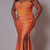 Tease Prom style TE2506 plus size fitted mermaid dress. Spaghetti straps on sweetheart pelated bodice with criss-cross boning and basque waistline. Slim fitted skirt with ruching and high slit. Available in fuchsia pink or tangerine orange.