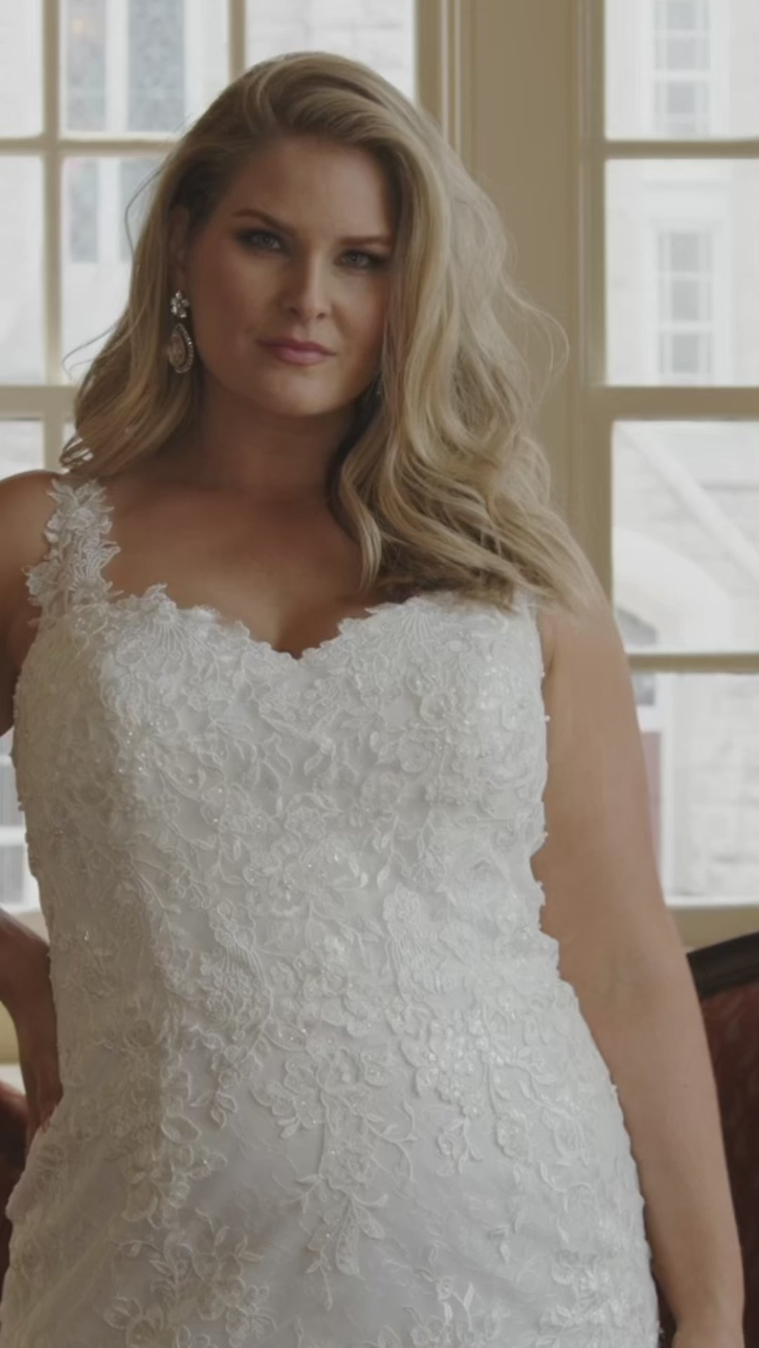 Michelle Bridal MB2428 Ivory. Sweetheart neckline, slim/fitted silhouette, lace appliques on net, Chantilly lace, lace covered hem, center back zipper,