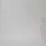 Woman models a blue off-the-shoulder A-line dress with a floral pattern, turning to show the back before walking off screen.