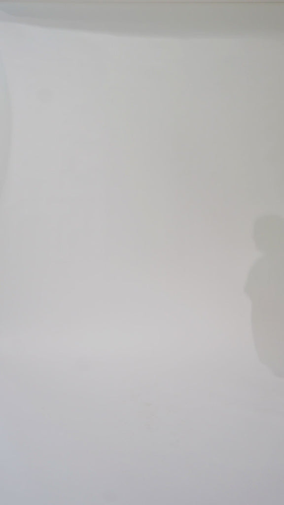 Woman models a blue off-the-shoulder A-line dress with a floral pattern, turning to show the back before walking off screen.