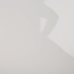 Woman models a black strapless satin ballgown with a deep V-neck and sequin and beaded detailing flowing from the bodice onto the skirt, showing the front and lace-up back before walking off screen.