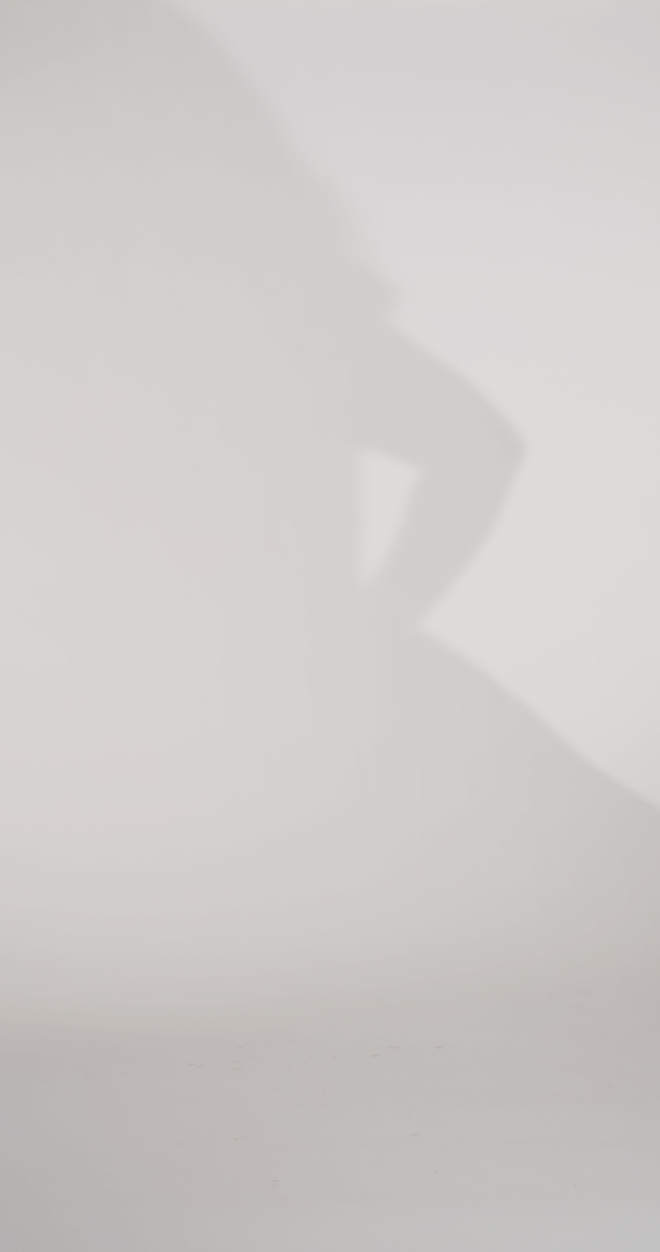 Woman models a black strapless satin ballgown with a deep V-neck and sequin and beaded detailing flowing from the bodice onto the skirt, showing the front and lace-up back before walking off screen.