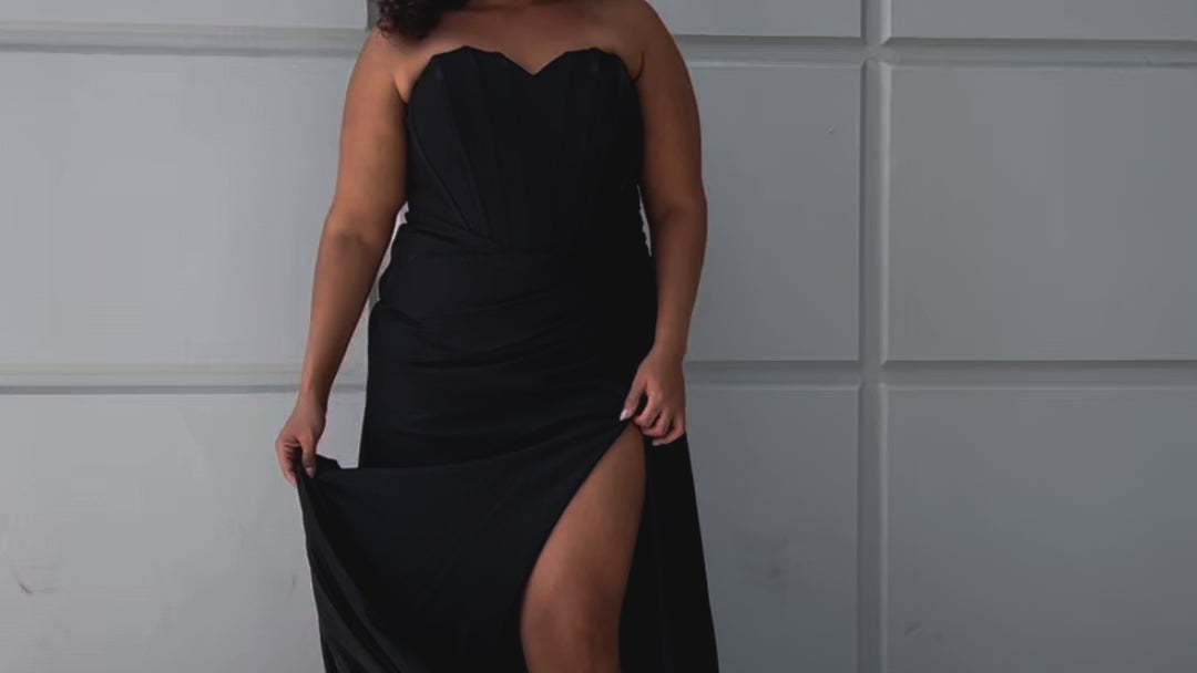 Sparkle stretch lycra plus size formal dress.  Strapless sweetheart neckline, basque waistline, exposed corset boning on bodice, ruchsed fitted skirt with high slit and zipper back. Available in sapphire blue, emerald green and onyx black. SC7412 by Sydney's Closet