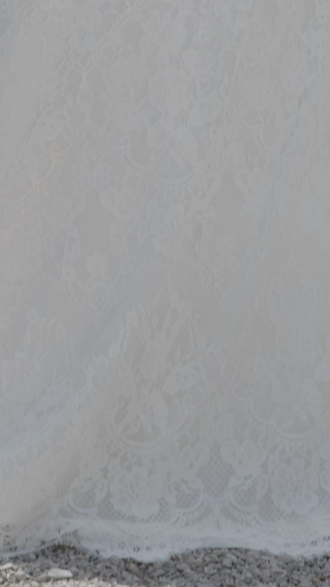 Michelle Bridal MB2417 Ivory. Floral lace, eyelash hem detail, deep v-neckline, natural waistline, optional back lining, A-line silhouette. 