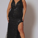 Plus size prom dress style TE2522 by Tease Prom is available in black.  Bra-friendly straps covered in glitter lace appliques with lac e trim on the deep V-neckline with nude mesh insert. Fitted skirt with high slit and lace detail on the trim of the slit. 