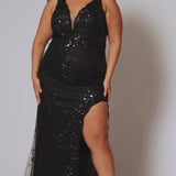 Plus size prom dress style TE2522 by Tease Prom is available in black.  Bra-friendly straps covered in glitter lace appliques with lac e trim on the deep V-neckline with nude mesh insert. Fitted skirt with high slit and lace detail on the trim of the slit. 