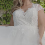 Michelle Bridal style MB2309 plus size bridal gown with modern lace appliques, hand beading, cap sleeve and long tulle skirt. Available in black or ivory. Only sold in stores.