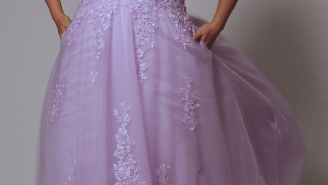 Plus size lace and tulle ball gown by Tease Prom.  Style TE2526 available in lilac purple or sage green.  Deep v-neckline with nude mesh insert. Wide straps and bodice fully covered with appliques.  Bodice is unlined but ships with optional lining panel.  Full A-line skirt with scattered lace appliques, pockets and sweep train. 