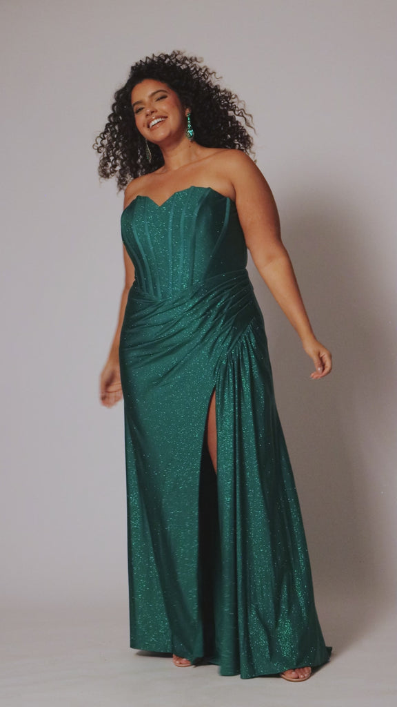 Sparkle stretch lycra plus size formal dress.  Strapless sweetheart neckline, basque waistline, exposed corset boning on bodice, ruchsed fitted skirt with high slit and zipper back. Available in sapphire blue, emerald green and onyx black. SC7412 by Sydney's Closet