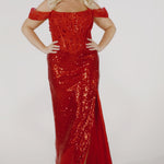 Three models, shown one at a time, wear a slim sequin dress with off-the-shoulder sleeves and a lace corset bodice in red, blue, and black.