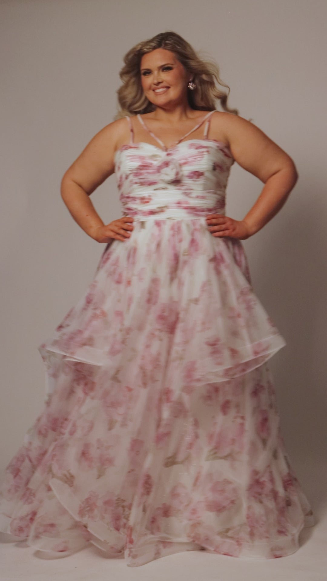 Tiered floral sprakle tulle ball gown by Sydney's Closet. Style SC7418 offers double spaghetti straps, pleated bodice with detachable flower braoch, full ball gown skirt with tiers. 