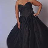 Long formal satin ballgown style SC7400 by Sydney's Closet. Available in sizes 14-32 in colors cobalt blue, onyx black and ruby red.  Pleated bodice with exposed boning, detachable pleated drape sleeves, basque waist and pockets.  