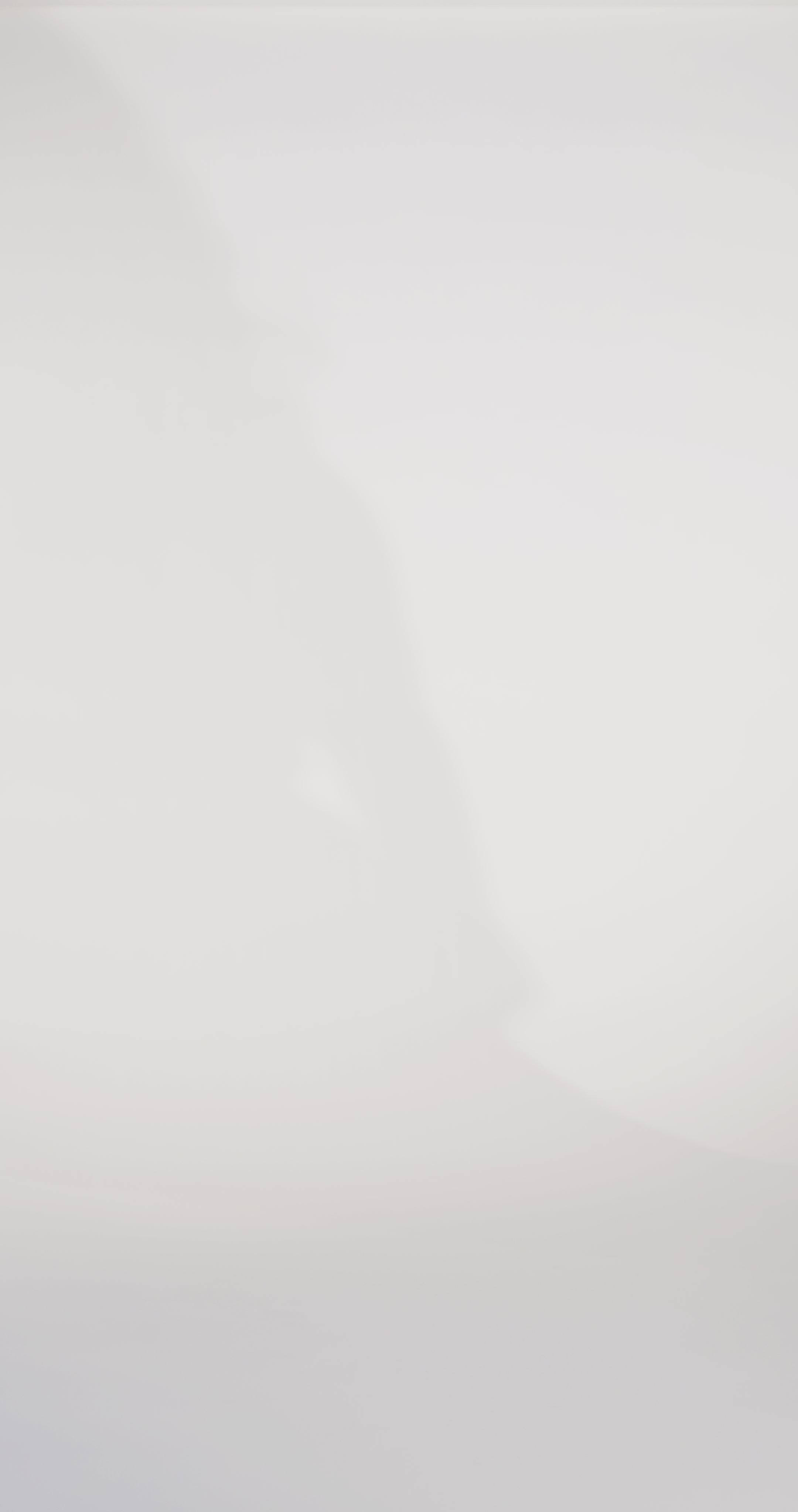 Woman models a black strapless fitted dress with a cat-eye neckline, exposed boning, rhinestones, and a pleated bust, showing the front and back before walking off screen.