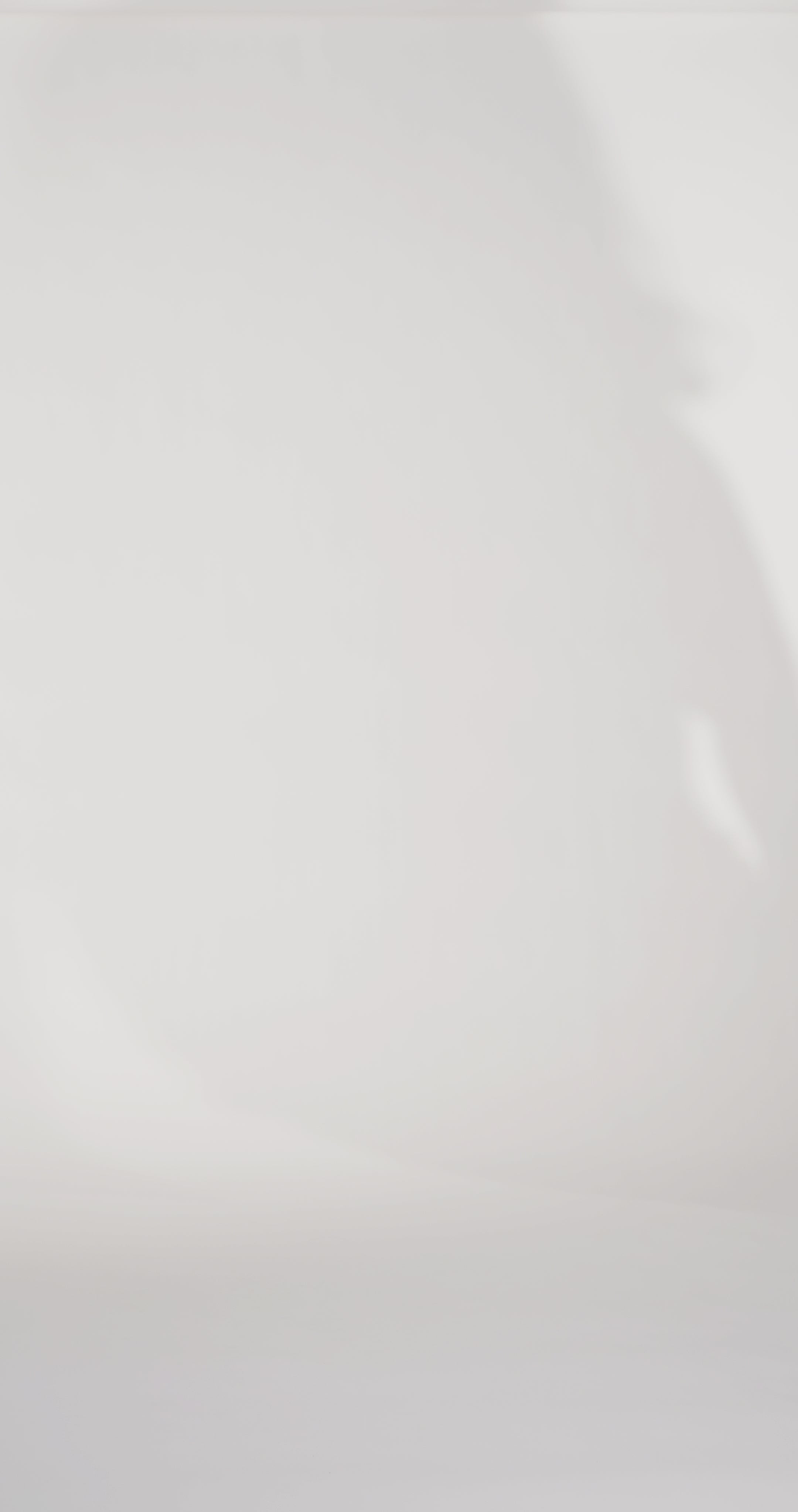 Woman models a berry colored strapless fitted dress with a cat-eye neckline, exposed boning, rhinestones, and a pleated bust, showing the front and back before walking off screen.