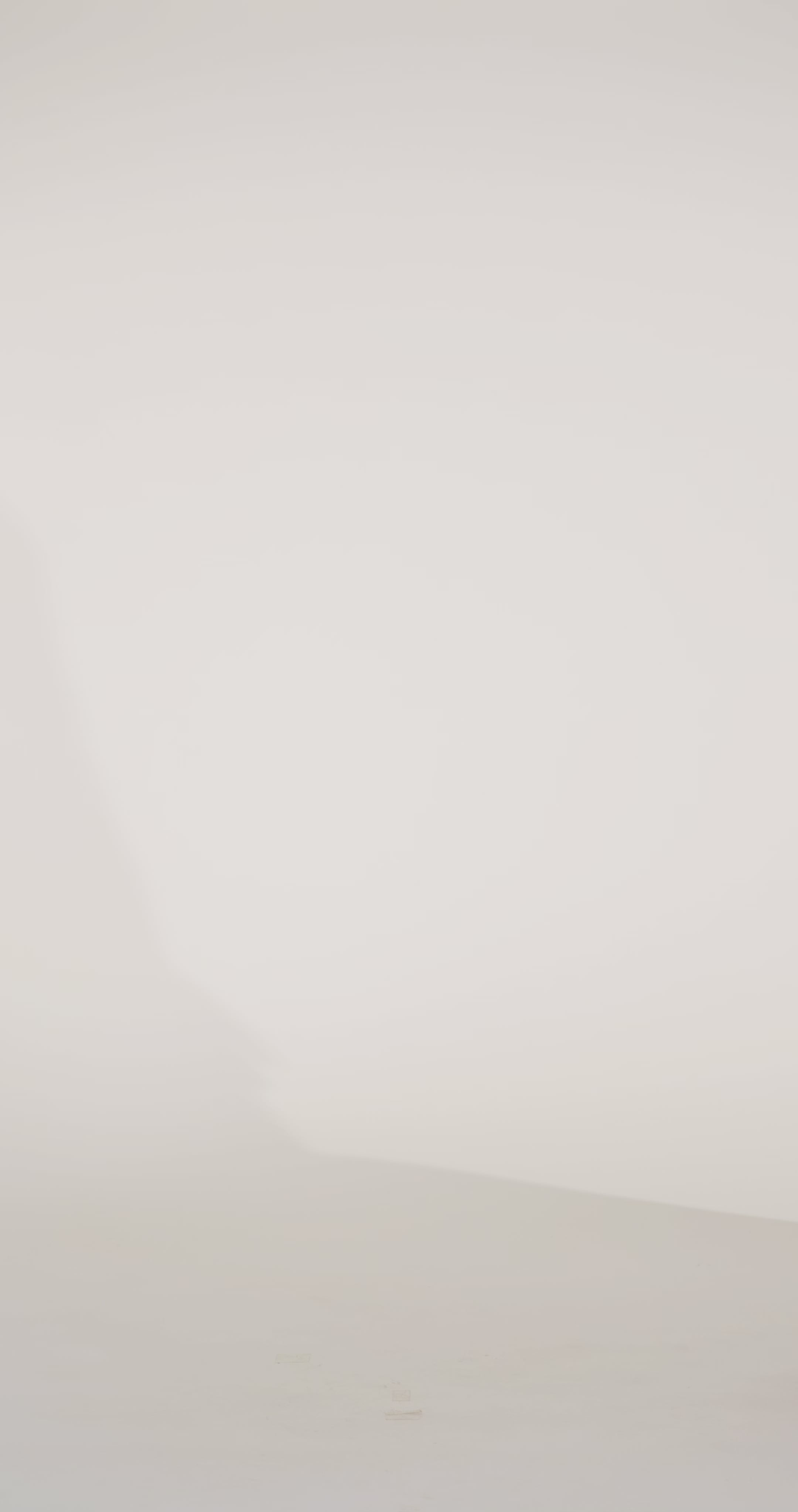 Woman models a pink brocade strapless mermaid dress, showing the front and lace-up back before walking off screen.