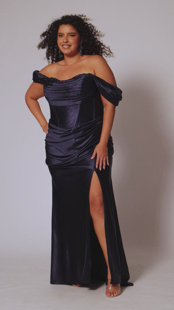 Sexy plus size fitted stretch satin formal evening dress with hot fix stones on top of sweetheart leated bodice, detachable drape sleeves, exposed corset boning, ruched fitted skirt with slit and lace-up back. SC7416 in burgundy red or navy blue by Sydney's Closet.