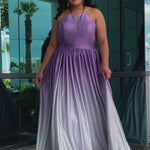 Plus size ombre prom ballgown. Halter neckline with nude mesh insert, waistband, gathered A-line skirt with pockets and horsehair hem.  Lace-up back with modesty panel. Available in purple or green by Sydney's Closet.
