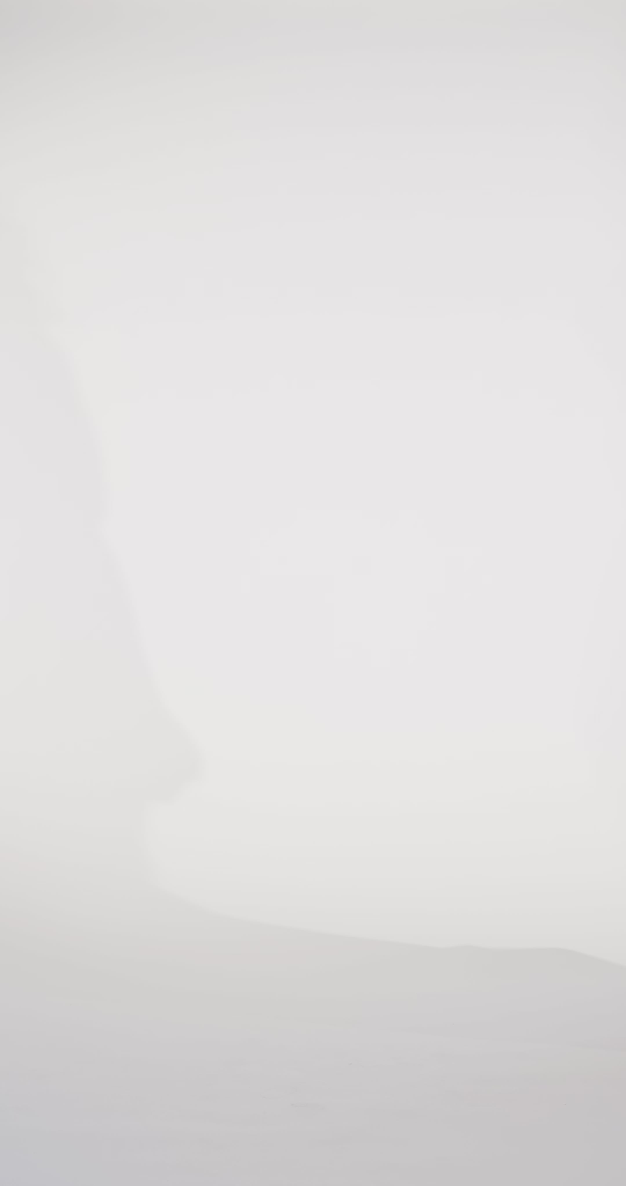 Woman models a sparkly red slim dress with a draped neckline and lace-up back, turning to show the back before walking off screen.