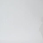 Woman models a floor length brown leopard print dress with a V-neckline and flutter sleeves, turning to show the back before walking off screen.