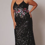 Tease Prom style TE2524 available in black with ivory floral sequin motif.  Spaghetti straps into a razor back with keyhole cutout. Deep V-neckline with black mesh. Slim fitted skirt with sweep train and horsehair hem. 