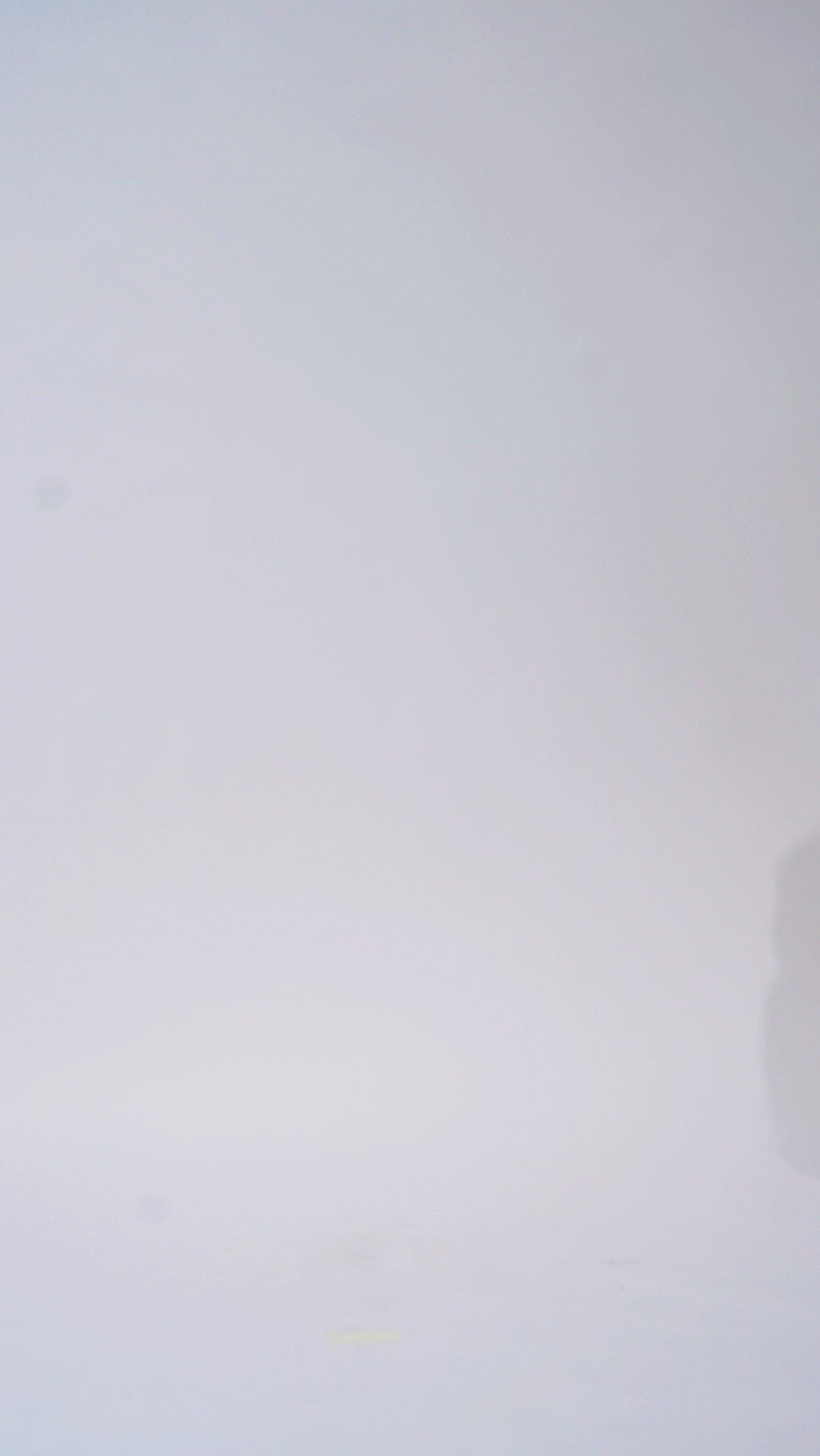 Woman models a blue off-the-shoulder A-line dress with a floral pattern, turning to show the back before walking off screen.