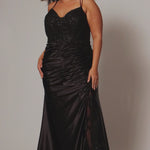 Sexy Plus Size fitted dress.  Double spaghetti straps, V-neckline covered in lace applqiues. Slim, fitted ruched skirt with slit. Slit filled in with lace. Ruched back size and tone-on-tone co vered buttons down the back. Avialable in onyx black.