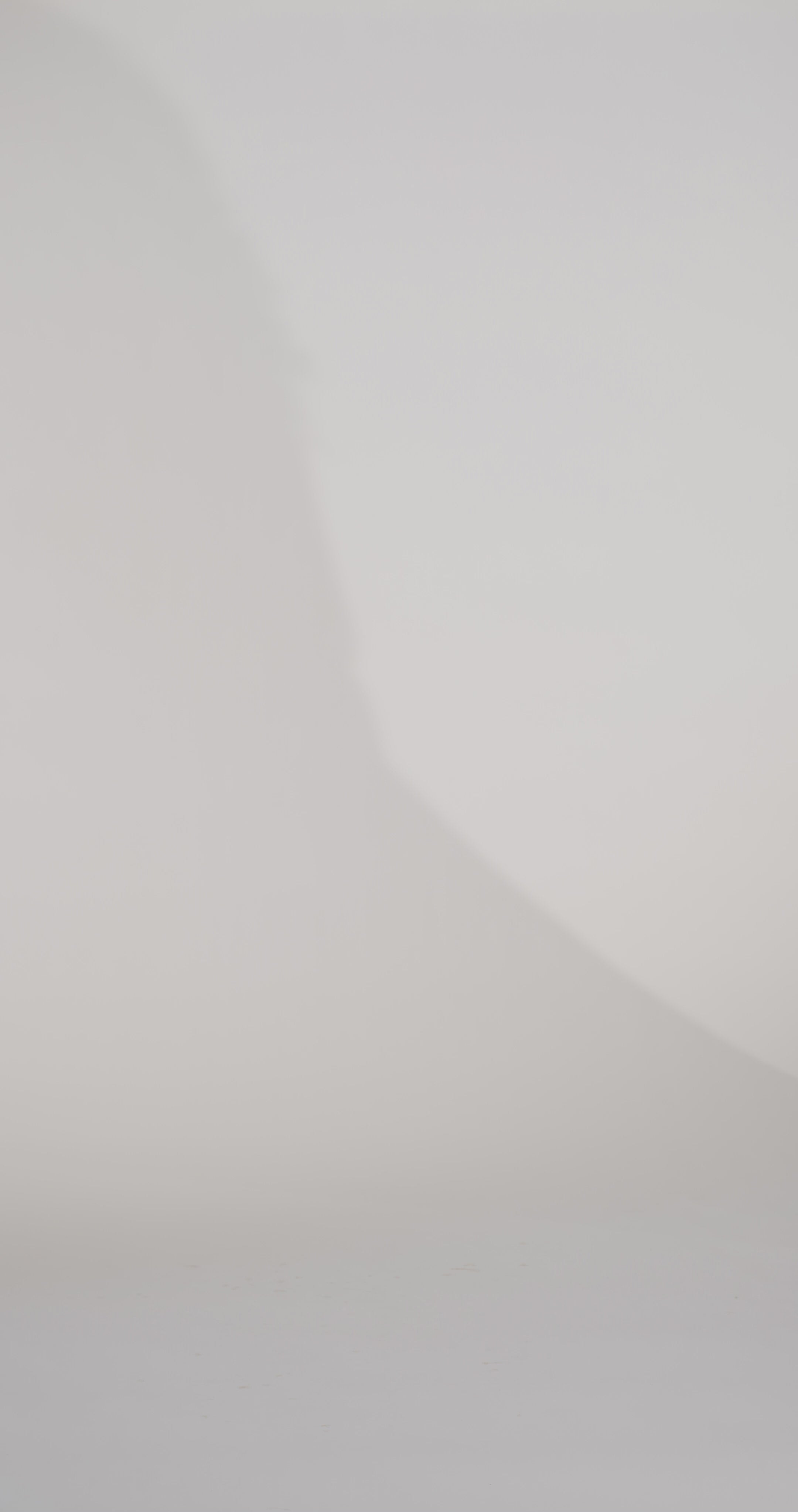 Woman models a burgundy strapless satin ballgown with a sweetheart neckline and oversized bow at the waist, showing the front and back before walking off screen.