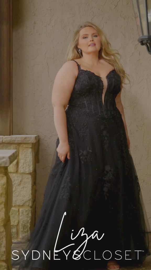 Video montage of two brides modeling an A-line wedding gown with a deep v-neckline and sparkling tulle, one dress is black one is white, shown outdoors from multiple angles and distances. The text “Liza” and the “Sydney's Closet” logo appear at the bottom.