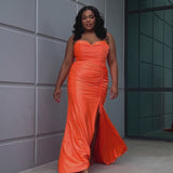 Slim fitted stretch satin plus size formal prom dress.  Pleated bodice, ruched skirt with gathered ties on slit, spaghetti straps and ruched back skirt with train.  Availablie in light blue, orange and lilac in sizes 14-24. Style SC7422 by Sydney's Closet. 