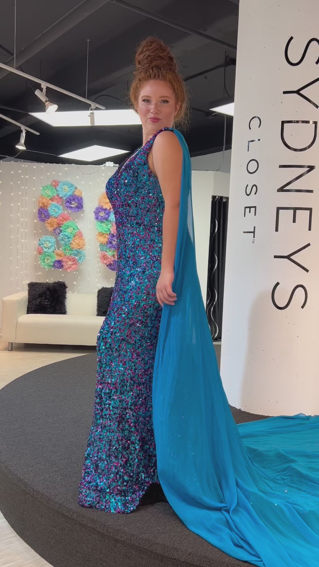 Johnathan Kayne for Sydney's Closet JK2407 Fuchsia Sky and Kaleidoscope. Slim/Fitted Silhouette, Multidimensional stretch sequin, V-neckline with black mesh insert, Bra-friendly straps, Natural waistline, V-back Long invisible center back zipper, Detachable chiffon cape = 105 inches from shoulder to hem, Slim skirt, Horsehair hem, Sweep train.