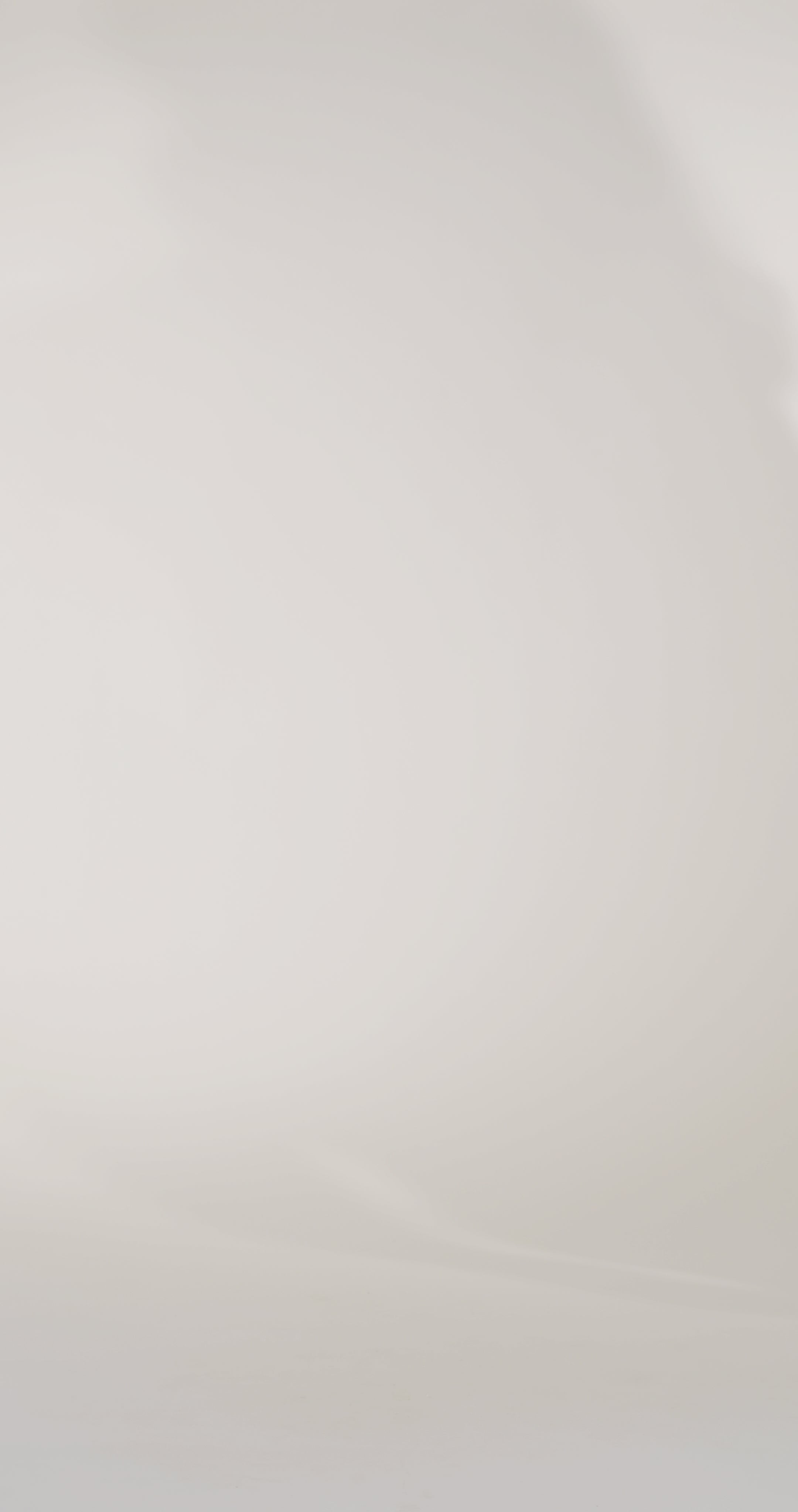 Woman models a blue brocade strapless mermaid dress, showing the front and lace-up back before walking off screen.