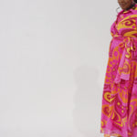 Celebration's by Sydney's Closet style CE2622 in abstract print. 

Button down plus size ankle length gown made from printed organza. V-neck, long pouf sleeves with cuff and optional belt. A-line skirt with pockets.