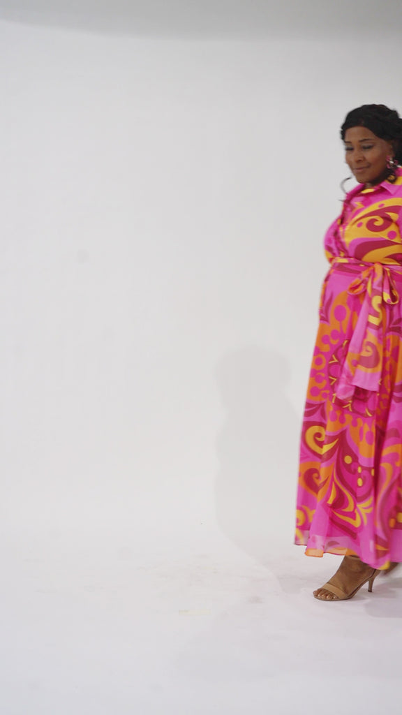 Celebration's by Sydney's Closet style CE2622 in abstract print. 

Button down plus size ankle length gown made from printed organza. V-neck, long pouf sleeves with cuff and optional belt. A-line skirt with pockets.