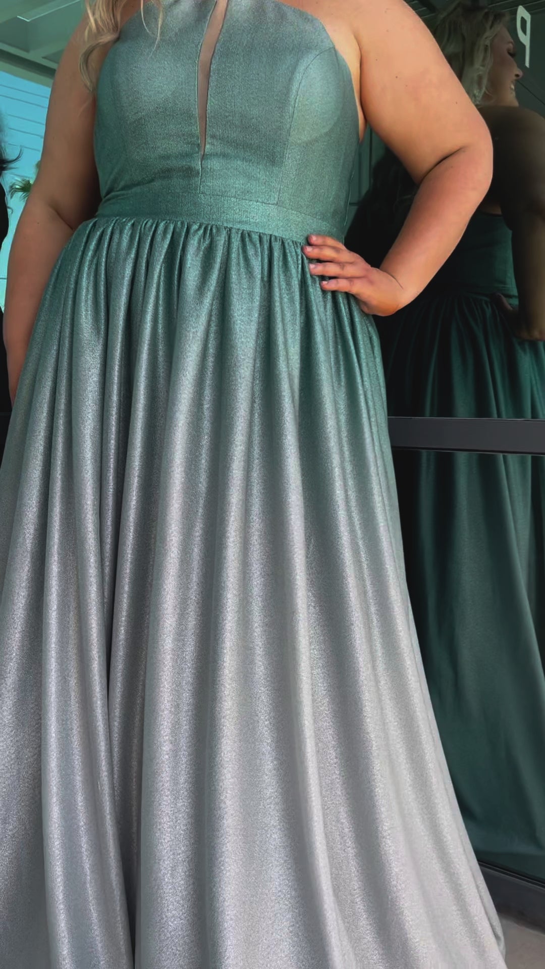 Plus size ombre prom ballgown. Halter neckline with nude mesh insert, waistband, gathered A-line skirt with pockets and horsehair hem.  Lace-up back with modesty panel. Available in purple or green by Sydney's Closet.