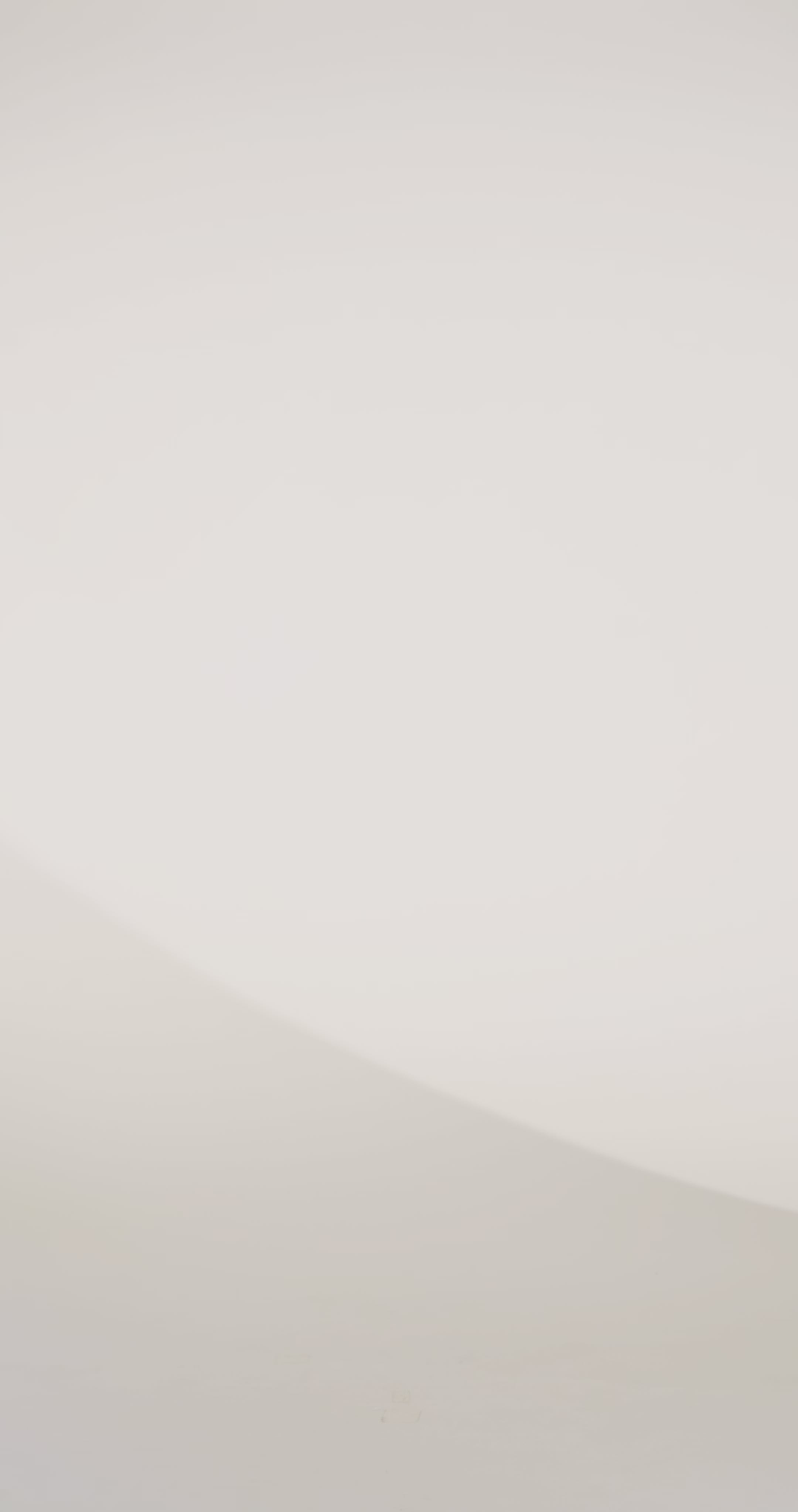 Woman models an off-the-shoulder A-line gown with a blue floral pattern and high slit, spinning to show the skirt before walking off screen.