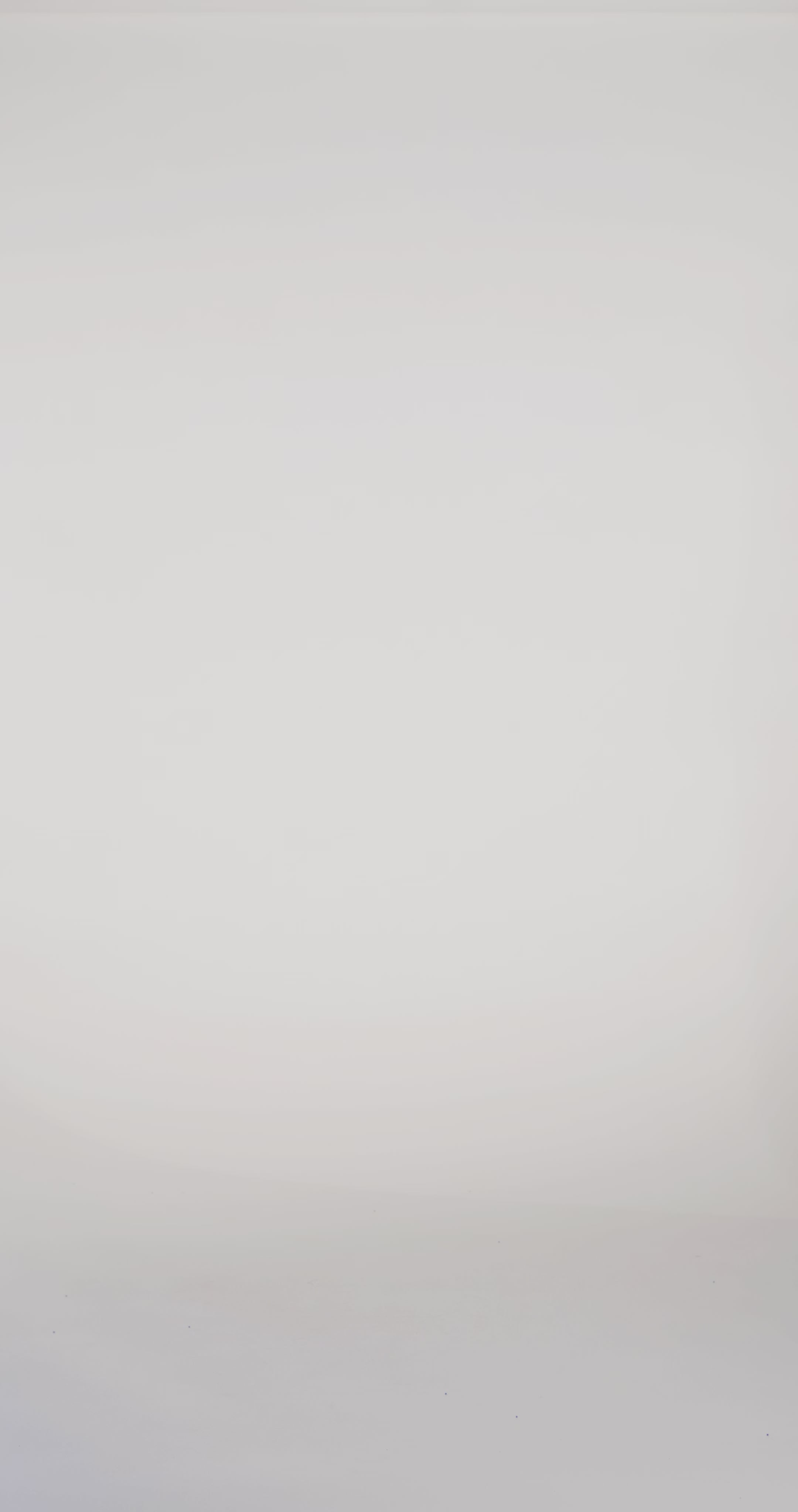 Woman models a teal strapless slim dress with a slit, exposed corset boning, a pleated band over the bust, and a sweep train, turning to show the lace-up back before walking off screen.