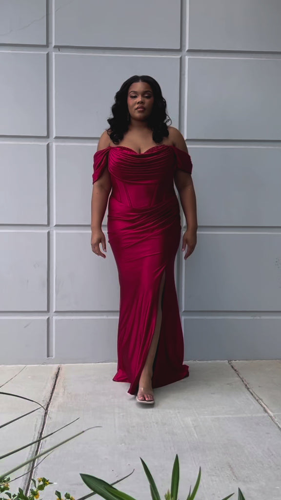 Sexy plus size fitted stretch satin formal evening dress with hot fix stones on top of sweetheart leated bodice, detachable drape sleeves, exposed corset boning, ruched fitted skirt with slit and lace-up back. SC7416 in burgundy red or navy blue by Sydney's Closet.