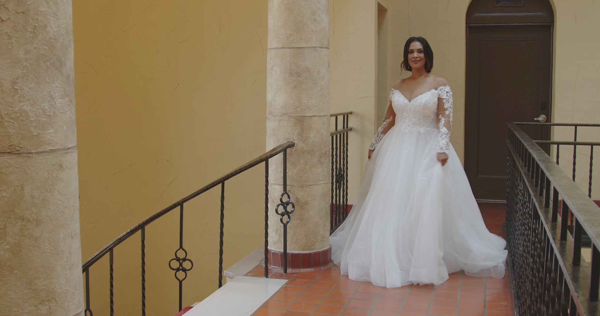 Michelle Bridal MB2412 Ivory. Soft bridal tulle, Sparkle tulle, light satin lining, Floral lace appliques with petal sequins, bugle beads, A-line silhouette, Slightly off-the-shoulder illusion bodice, Sweetheart neckline, Long illusion mesh sleeves covered in lace appliques to match bodice, Natural waistline, Full A-line skirt with 3.5 inch horse hair hem.