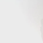 Woman models a strapless tea-length dress with a brown and black animal print and folded neckline detail, turning to show the back before walking off screen.