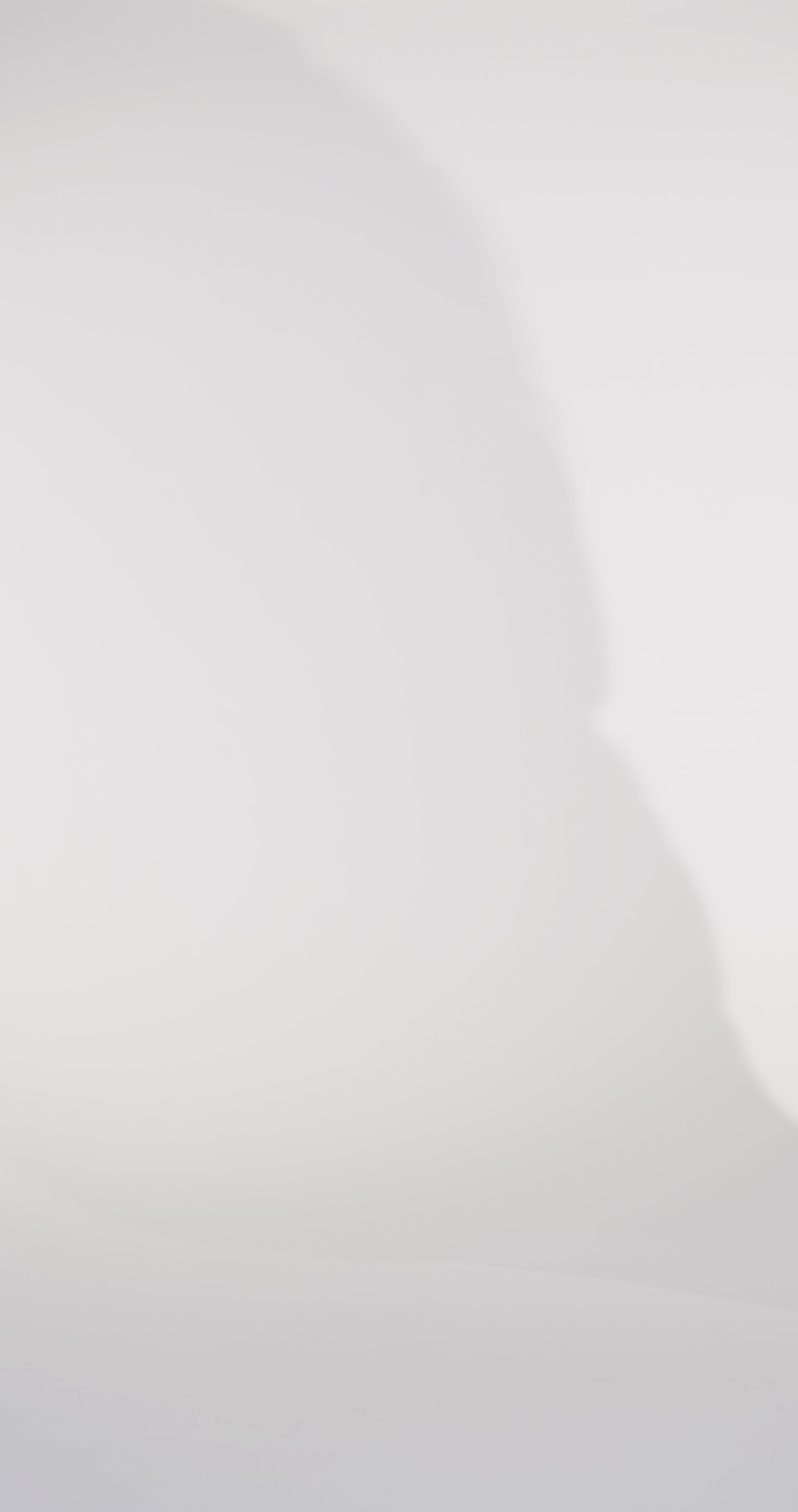 Woman models a slim red dress with a slit, exposed corset boning, a pleated band over the bust, and rhinestones along the neckline, showing the front and back before walking off screen.