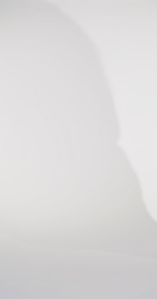 Woman models a slim red dress with a slit, exposed corset boning, a pleated band over the bust, and rhinestones along the neckline, showing the front and back before walking off screen.