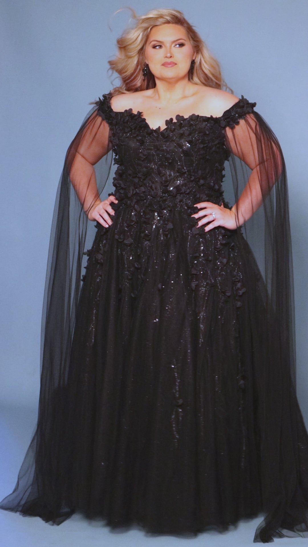 Sydney's Closet SC5315 Black. Detachable tulle scarves, Detachable spaghetti straps, Ball gown silhouette, Off-the-shoulder strap with elastic band, Detachable tulle scarves, Sweetheart neckline, Full ball gown skirt, Long invisible center back zipper, Chiffon 3D flowers on glitter net over sparkle tulle.