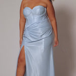 Sexy fitted pastel plus size prom dress by Tease Prom. Style TE2528. Strapless  bodice with assymetrical basque waistline. Exposed corset boning and bustier bodice is fully lined.  Ruchsing and knot detail at the waistline and high slit with sweep train on a fitted skirt.  Tease Prom style TE2528 is available in lavender purple or sky blue in plus sizes 14-24. 