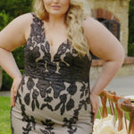 Plus-size bride modeling the MB2606 wedding gown by Michelle Bridal, showcasing a supportive bodice and elegant flowing silhouette designed for curvy brides.